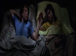 2 boys sleeping together